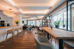 a restaurant with a long table and chairs at Belvedere in Prague