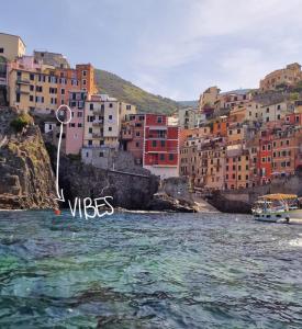 a view of a city from the water with buildings at Vibes 5terre in Riomaggiore