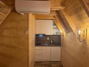 a kitchen in a tiny house at Brvnare Sadba  +14 photos