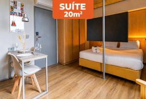 a bedroom with a bed and a desk with a sign that reads suite at Linked Batel Curitiba by Xtay in Curitiba