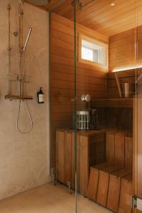 a bathroom with a shower and a glass shower stall at Ainur Villas in Saariselka