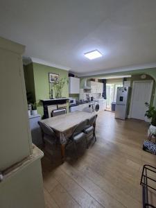 a kitchen with a table and chairs in a room at Castle Room in Windsor