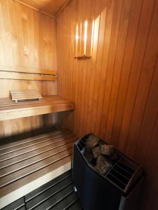 a small sauna with a shelf and logs in it at Tanguero Hotel Boutique Antique in Buenos Aires +78 photos