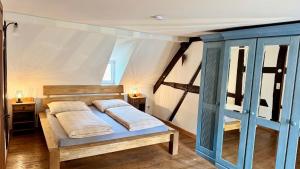 a bedroom with a bed and two night stands at Schlossgut Franken in Redwitz an der Rodach