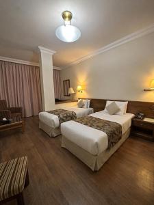 En eller flere senge i et værelse på Orient Prince Hotel + 28 billeder