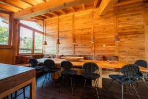 a dining room with wooden walls and a table and chairs at Chalet Namapa in Saint-Martin-de-Belleville +63 photos
