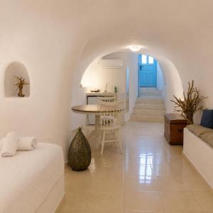 a living room with a couch and a table at SantoCaves in Akrotiri