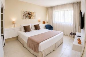 Katil atau katil-katil dalam bilik di Orange Praia Hotel