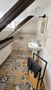 a bathroom with a sink and a toilet and a sink at Rustic House v Lužických horách in Jiřetín pod Jedlovou