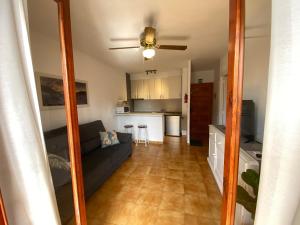a living room with a couch and a kitchen at Apartment with private balcony in San Javier