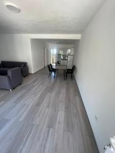 a living room with a table and a couch at Rujovic 