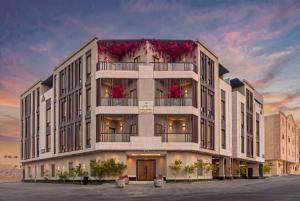 un rendering di un edificio con fiori sopra di Amber Hospitality - Qurtubah a Riyad
