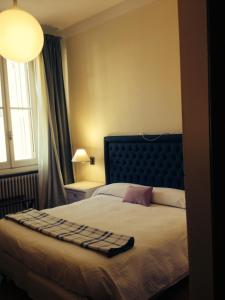 Een bed of bedden in een kamer bij Hotel Miramare