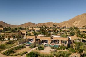 an aerial view of a resort in the desert at Six Senses AMAALA in Amala