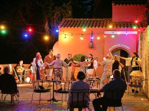 a group of people performing on a stage at Nido, Mar-Bella Collection an SLH hotel 16 years plus in Agios Ioannis Peristerion +103 photos