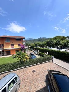 a car parked in front of a house at Terrazza sul Lago in Riva del Garda