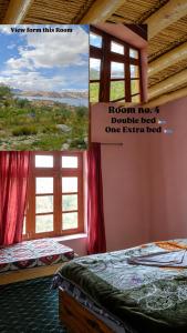 a room with two beds and a sign that reads room no double bed at Deachen Khangsar in Spangmik