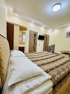 a bedroom with a large bed in a room at Hotel Dilijan Old Center in Aghk'ilisa