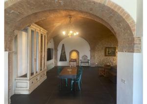 a room with a table and chairs in a building at Casa Del Principe in Gambassi Terme