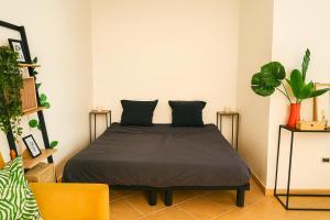 a bedroom with a bed with two pillows on it at Océan serinity Santa Maria in Santa Maria