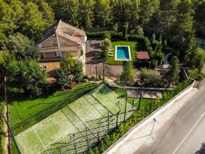 an aerial view of a house with a garden at Carrasca 8 paddle & pool in Alcoy +50 photos