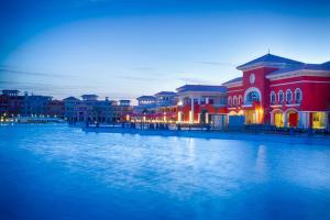 a group of buildings next to a body of water at Porto Sharm Elshiekh Vacation Hotel in Sharm El Sheikh