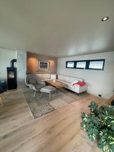 a living room with a couch and a table at The Hidden Gem in Ålesund