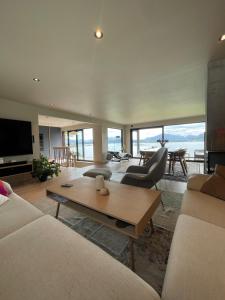 a living room with a couch and a coffee table at The Hidden Gem in Ålesund