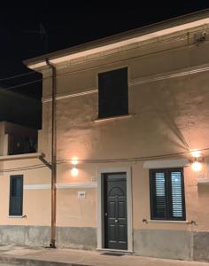 a building with a speaker on the side of it at A Due Passi da MicheIino in Parghelia