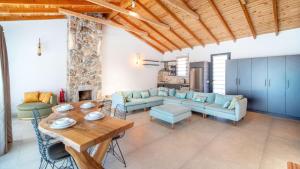 a living room with a couch and a table at Villa Lagerta in Kayakoy