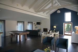 a living room with a ping pong table in it at Casa Valxisto in Penafiel