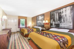 Ένα ή περισσότερα κρεβάτια σε δωμάτιο στο Super 8 by Wyndham Dublin +46 φωτογραφίες