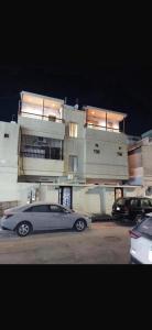 a car parked in a parking lot in front of a building at استوديو مميز بأثاث مريح in Al Khobar