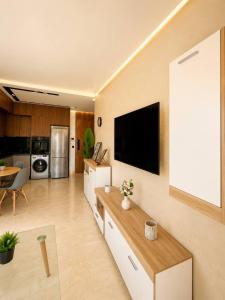 a living room with a flat screen tv on a wall at Premium studio Casablanca in Maarif