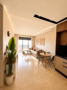 a living room with a couch and a table at Premium studio Casablanca in Maarif