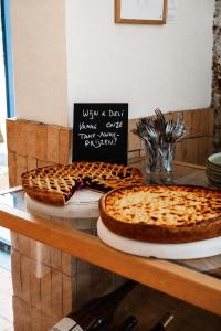 two pies sitting on top of a table at K-Kanne in Kanne