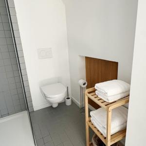 a small bathroom with a toilet and a shower at De Watermolen in Ninove +42 photos