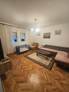 a living room with a couch and a table at Apartment Jasovic in Ulcinj