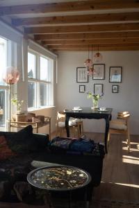 a living room with a couch and a table at Solhaven in Selfoss