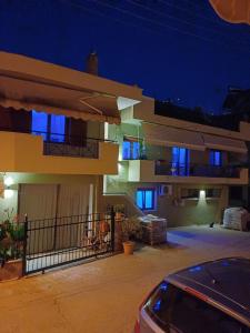 a house with a car parked in front of it at night at LA.KI House in Kavála