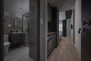 a large bathroom with a sink and a stove at Hebrard Industrial Suites in Thessaloniki