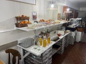 a buffet line with many plates of food at Hotel Edelweiss in Arties