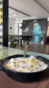 a bowl of food with bananas in a table at Moonshiva stay and cafe in Rishīkesh