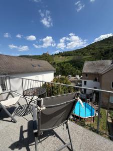 a balcony with a table and a boat on it at Burgblick in Bernkastel-Kues