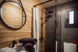 a bathroom with a shower and a sink and a mirror at A Constanza Portecelo in Rosal +57 photos