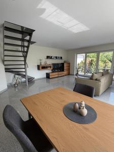a living room with a table and a couch at Burgblick in Bernkastel-Kues