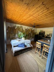 a living room with a couch and a table at GENUSSZEIT Cottage in Udenhain