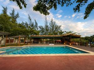 a swimming pool in front of a house at Stress Zero in Lopes