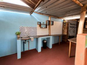 a room with a table and a sink in a room at Stress Zero in Lopes