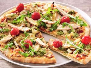 three slices of pizza on a white plate at Hotel Ibis Coimbra Centro in Coimbra